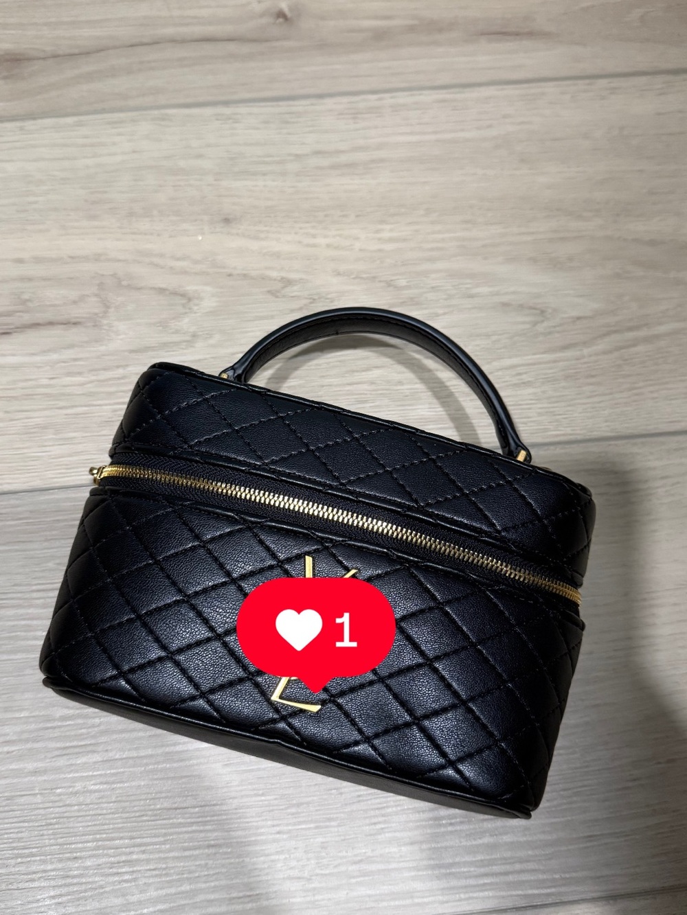 Black Quilted Top-Handle Vanity Bag with Gold Hardware